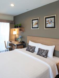 Cama o camas de una habitación en Viva Garden Serviced Residence