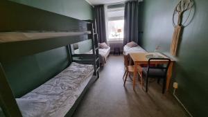 Säng eller sängar i ett rum på Piteå Vandrarhem