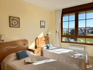 a bedroom with two beds and a window at Cinco Soles - 5927 in Isla +32 photos
