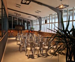 a room with a bunch of chairs and a table at Einzigartiges Industrie Loft Atelier in Bad Salzuflen