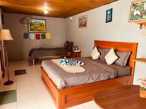 Postel nebo postele na pokoji v ubytování Bukit Catu Bungalows