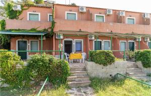 a building with a table and chairs in front of it at Apt 202 in Agropoli