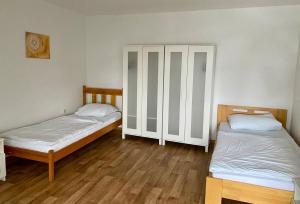Postel nebo postele na pokoji v ubytování Penzion První Liga