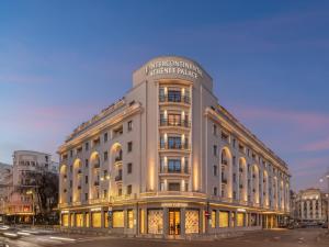 a building with a sign on the top of it at InterContinental Athenee Palace Bucharest by IHG in Bucharest