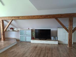 a large living room with a flat screen tv at Ferienwohnung Schack in Bodensdorf