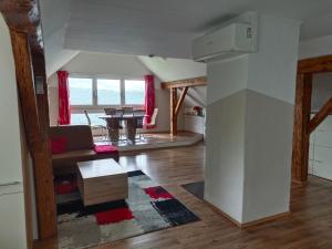 a living room with a couch and a table at Ferienwohnung Schack in Bodensdorf