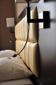 Postel nebo postele na pokoji v ubytování Hotel Minerva