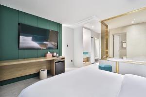 Postel nebo postele na pokoji v ubytování Hotel Ippda Gumdan