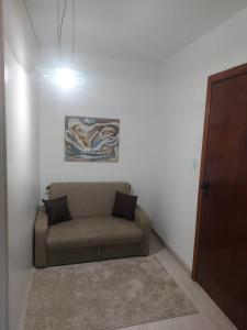 Posezení v ubytování Flat próximo ao Shopping e Praia + 1 fotografie