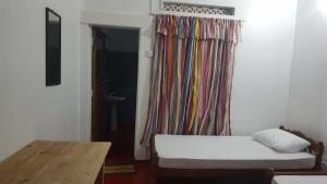 Ένα ή περισσότερα κρεβάτια σε δωμάτιο στο Kingfisher Guesthouse and Hostel