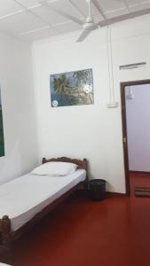 Ένα ή περισσότερα κρεβάτια σε δωμάτιο στο Kingfisher Guesthouse and Hostel