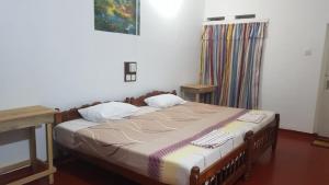 Ένα ή περισσότερα κρεβάτια σε δωμάτιο στο Kingfisher Guesthouse and Hostel