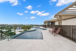 a swimming pool on the balcony of a building at "The Mowbray"-Luxury,rooftop pool,gym,free parking in Brisbane