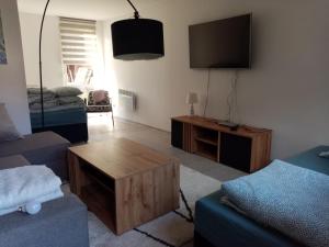 a living room with a couch and a coffee table at Domki OW Rycerka in Rajcza