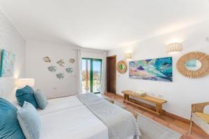 Łóżko lub łóżka w pokoju w obiekcie Villas la Gomera