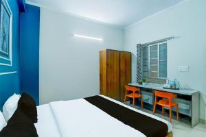 Postel nebo postele na pokoji v ubytování Hotel O SS + 21 fotografií