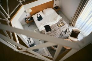 Letto o letti in una camera di Palazzo del Corso – Boutique Hotel