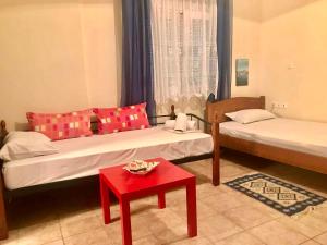 A bed or beds in a room at PLAZA Studios
