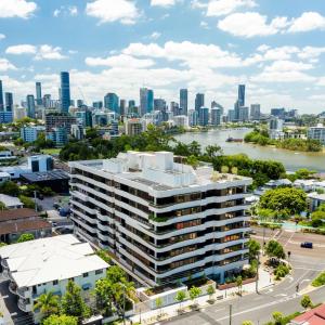 an aerial view of a large building in front of a city at "The Mowbray"-Luxury,rooftop pool,gym,free parking in Brisbane