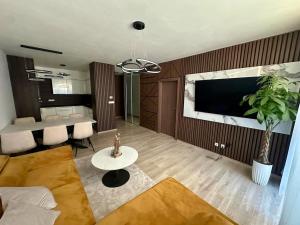 Posezení v ubytování Moderný 3i byt s balkónom