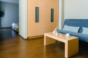 Postel nebo postele na pokoji v ubytování Elysion Hotel