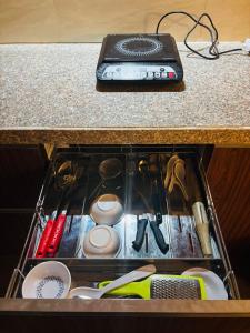 a drawer in a counter top with a drawer at Dun Haven Height in Dehradun