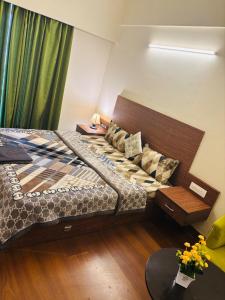 a bedroom with two beds and a window at Dun Haven Height in Dehradun