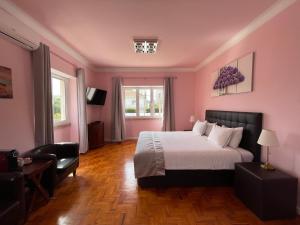 Postel nebo postele na pokoji v ubytování SK Lisboa Villa Guesthouse