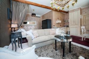 a living room with a couch and a table at Apartment Piazza in Rovinj