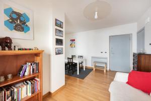 a living room with a couch and a table at Private Condo Terrace & Parking in Rome