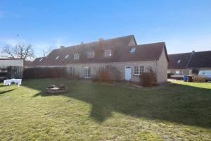 a large house with a large yard in front of it at Haus Herr Krug in Walkendorf