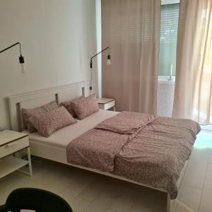 A bed or beds in a room at Come.in