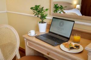 Postel nebo postele na pokoji v ubytování Hotel Santa Costanza by OMNIA hotels