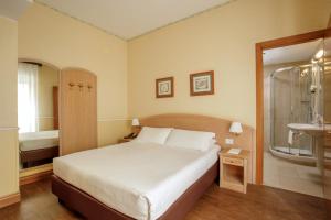 Postel nebo postele na pokoji v ubytování Hotel Santa Costanza by OMNIA hotels