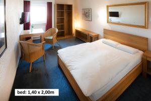 Una cama o camas en una habitación de Elan Hotel