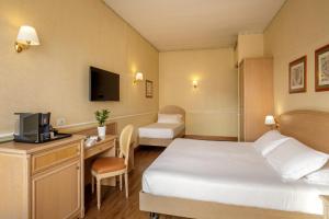 Postel nebo postele na pokoji v ubytování Hotel Santa Costanza by OMNIA hotels