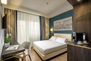 Postel nebo postele na pokoji v ubytování Hotel Santa Costanza by OMNIA hotels