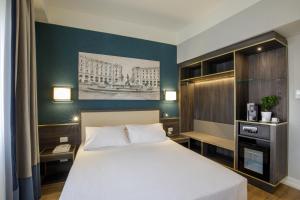 Postel nebo postele na pokoji v ubytování Hotel Santa Costanza by OMNIA hotels