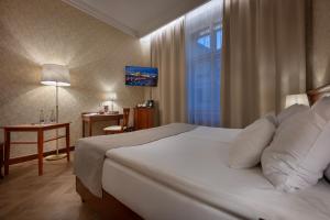 Postel nebo postele na pokoji v ubytování Hotel Rott