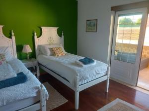 Giường trong phòng chung tại Casa Botanica