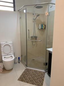 a bathroom with a shower and a toilet at LuxNar Beach GF in La Gaulette +14 photos