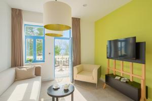 TV a/nebo společenská místnost v ubytování Boutique Hotel Esplanade
