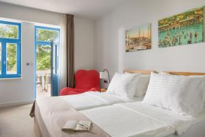 Postel nebo postele na pokoji v ubytování Boutique Hotel Esplanade