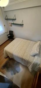 Posteľ alebo postele v izbe v ubytovaní Apartamento Turístico Menéndez Pelayo -Vigo