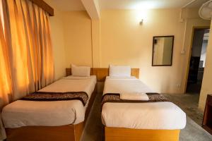 Uma cama ou camas num quarto em Hotel Nana