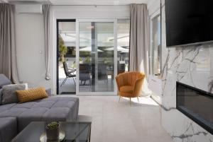 a living room with a couch and a fireplace at Beautiful Villa Tyara in Zaton
