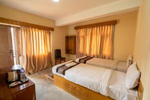 Uma cama ou camas num quarto em Hotel Nana