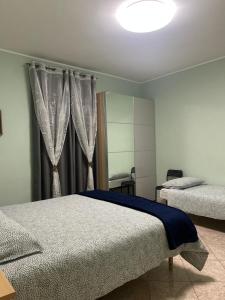 Postel nebo postele na pokoji v ubytování B&B Antonella