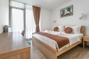 Postel nebo postele na pokoji v ubytování Hotel Onogošt