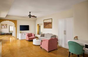 a living room with a couch and two chairs at Storii By ITC Hotels, Jaisalmer in Jaisalmer